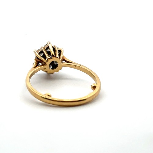 32 - A diamond 'flower' ring in yellow gold mount, stamped 18ct. Size approx M with sizing beads. Estimat... 