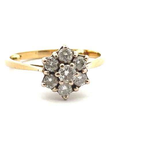 32 - A diamond 'flower' ring in yellow gold mount, stamped 18ct. Size approx M with sizing beads. Estimat... 