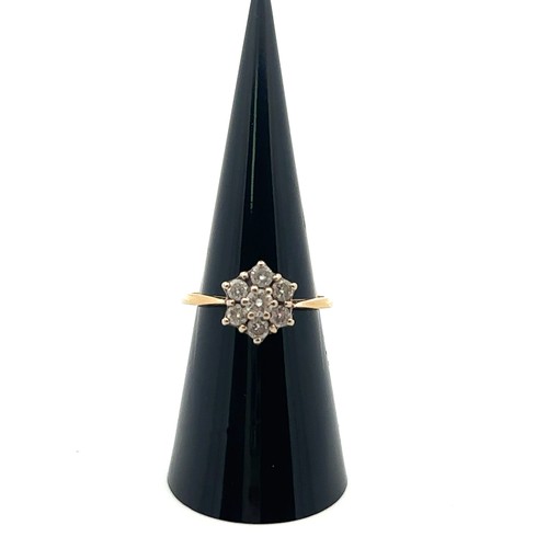 32 - A diamond 'flower' ring in yellow gold mount, stamped 18ct. Size approx M with sizing beads. Estimat... 