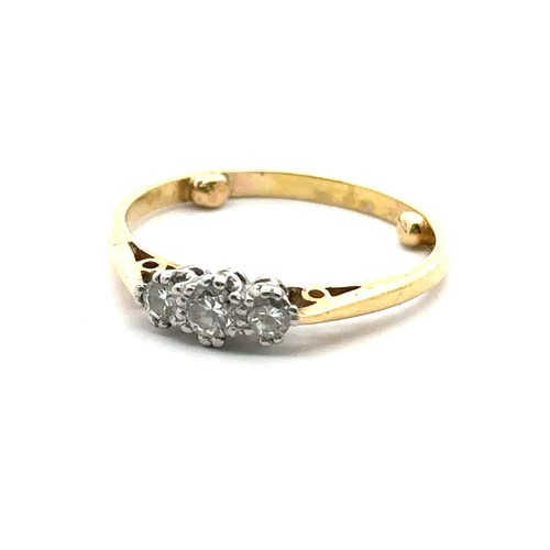 33 - A three stone diamond ring, hallmarked 18ct, sponsor mark M&M. Size approx O with sizing beads. Weig... 