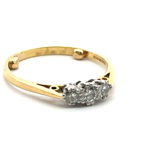 33 - A three stone diamond ring, hallmarked 18ct, sponsor mark M&M. Size approx O with sizing beads. Weig... 