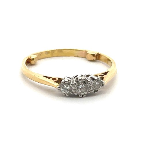 33 - A three stone diamond ring, hallmarked 18ct, sponsor mark M&M. Size approx O with sizing beads. Weig... 