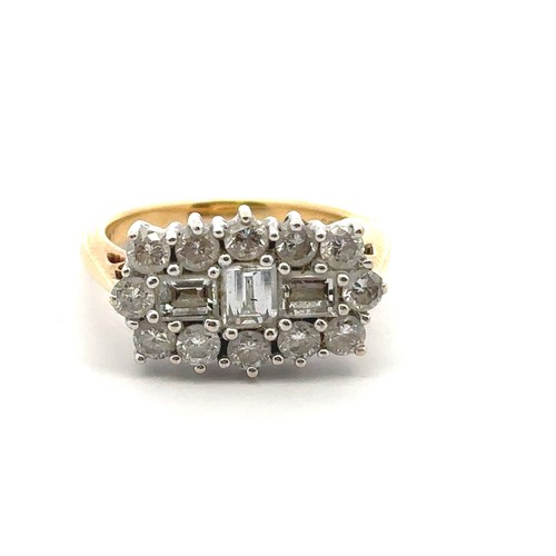 34 - An 18ct and diamond cluster ring - set with three baguette cut diamonds surrounded by 12 round brill... 