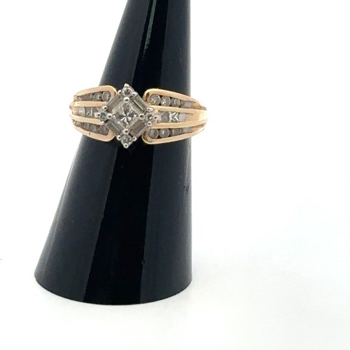 56 - Diamond cluster ring with central princess cut diamond of approx 0.2ct surrounded by 4 baguette and ... 