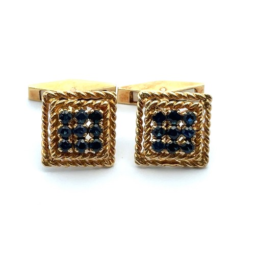 17 - A pair of 18ct yellow gold cufflinks with rope twist designed mount and set with nine round sapphire... 