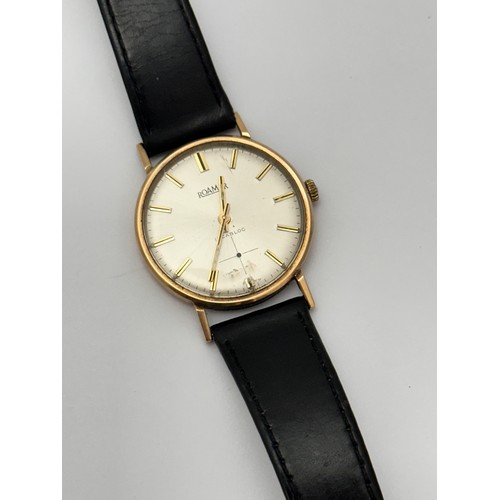 112 - A 9ct gold Roamer wrist watch with black leather strap. Inscribed to case back 'Presented by Carrs P... 