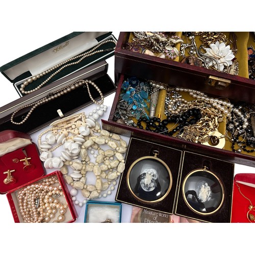 90 - A wooden jewellery box together with a large amount of costume jewellery.