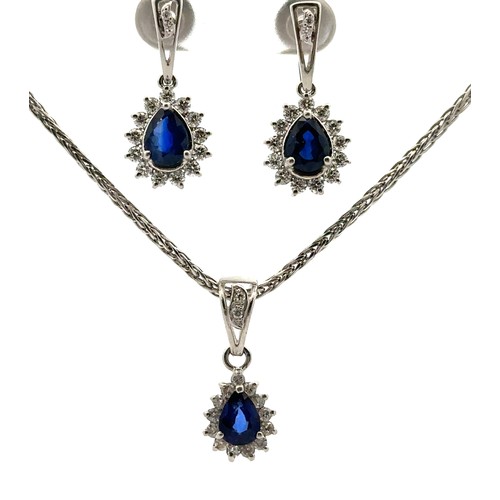 30 - A sapphire and diamond necklace and earrings set. The necklace with a central pear shaped sapphire s... 