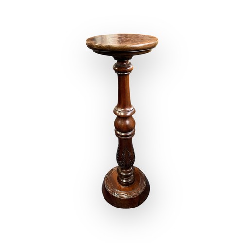 476 - A mahogany jardiniere stand with carved pillar. H75cm, diameter 24.5cm.