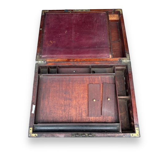 477 - A brass-bound Victorian writing box with original brass bounds and key. Some need refitting to side ... 