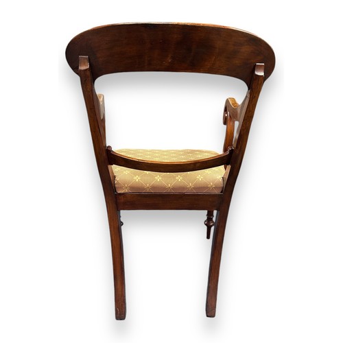 478 - Regency Style Mahogany Scroll Arm Chair. With upholstered cushioned seat, cupped legs with cylindric... 