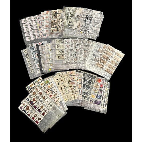 297 - Collection of cigarette cards, mainly complete sets in plastic sleeves, condition is variable, but m... 