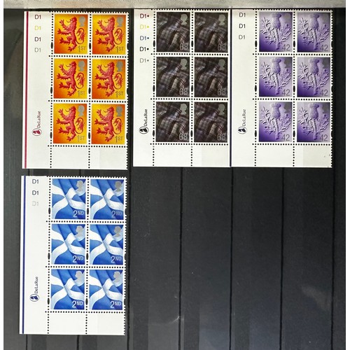 125 - GB. Regionals UM collection in four stockbooks vals to £1.90 incl medium to h/v cylinder blocks of 6... 