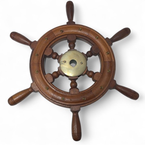 276 - An unmarked wood and brass ship's wheel. Diameter 52cm. The proceeds from this lot will go to the Br... 