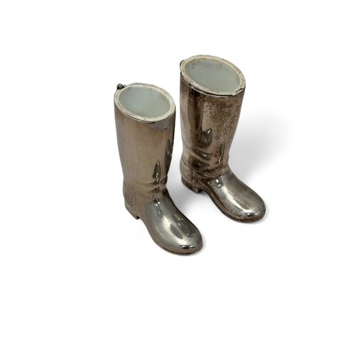 130 - A pair of silver plated 'boot' spirit measures. White liners for single and double measures.