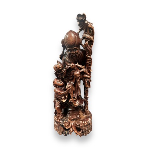 365 - Large Oriental Wooden Carving & Various Other Carvings. Large intricately carved wooden statue, suff... 