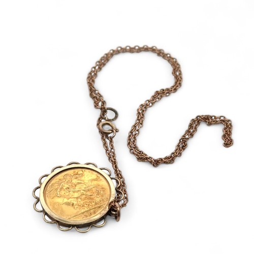 9 - A sovereign pendant necklace. A 1965 sovereign coin mounted in hallmarked 9ct gold on a chain stampe... 