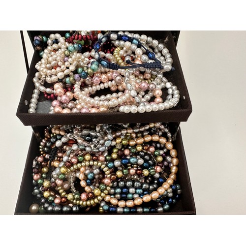 26 - A jewellery box containing numerous pearl (many dyed) and  necklaces, bracelets and earrings, many w... 