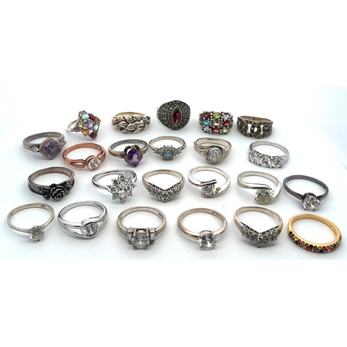 22 - A collection of 23 Silver / 925 rings. Many set with gemstones. Sizes S to V.