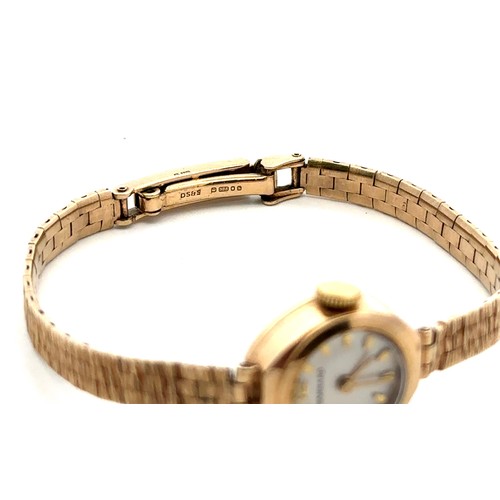 73 - A Garrard ladies 9ct gold watch with 9ct gold bracelet. Inscribed to back of case 'For Dunlop servic... 