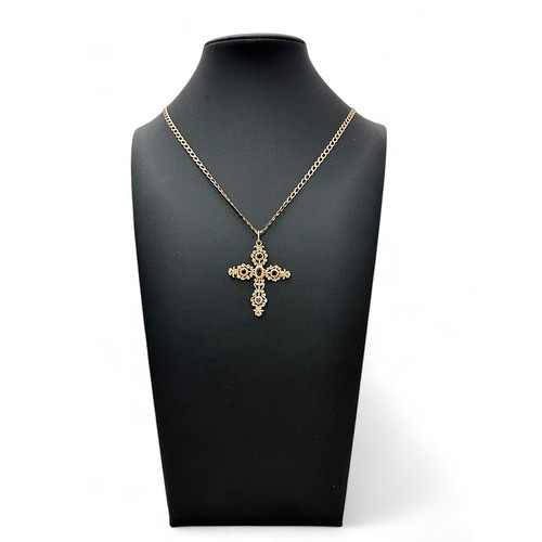 5 - An attractive 9ct gold and garnet cross pendant necklace on a hallmarked 9ct gold chain.