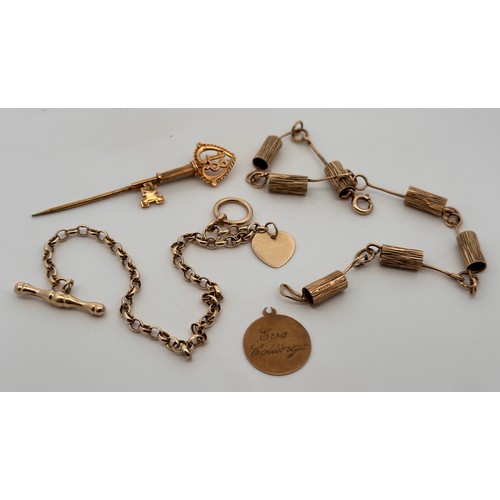 63 - Four 9ct gold jewellery items. To include a bracelet with bark effect cylinders, hallmarkes to cylin... 