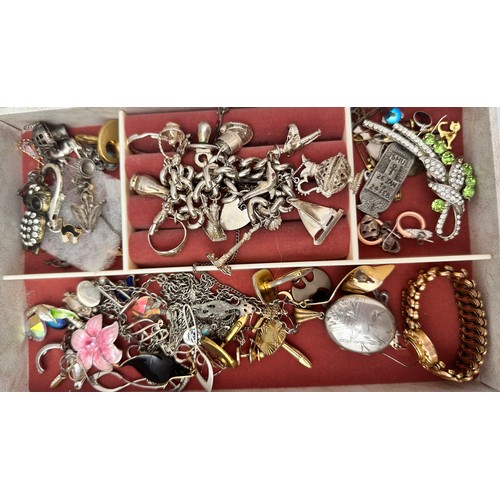 52 - A jewellery box containing silver and costume jewellery including a silver charm bracelet. Also a pa... 