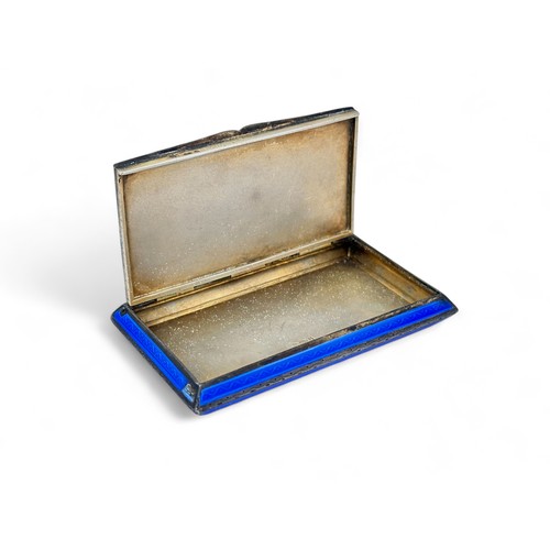 97 - A blue guilloche enamel and silver snuff box. London import marks for 1926 to gilt interior, makers ... 