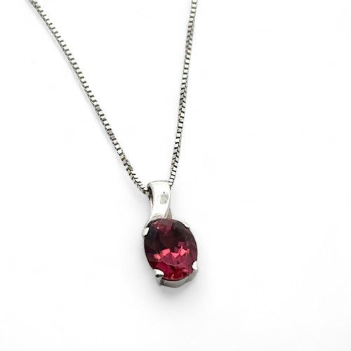 2 - A pink tourmaline pendant necklace. Tourmaline 8mm x 6mm. Pendant 13mm in length set in unmarked whi... 