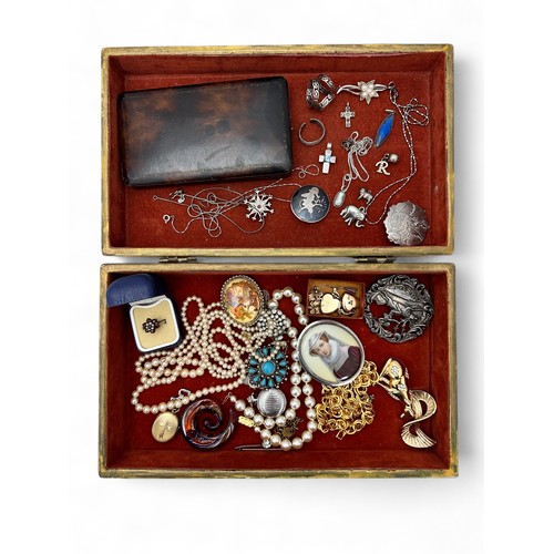 32 - A jewellery box containing silver and costume jewellery. Includes a Siam brooch, a Norwegian Tinn pe... 