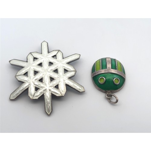 39 - Two Norwegian silver and enamel jewellery items. A silver and enamel snowflake brooch by A Scandinav... 