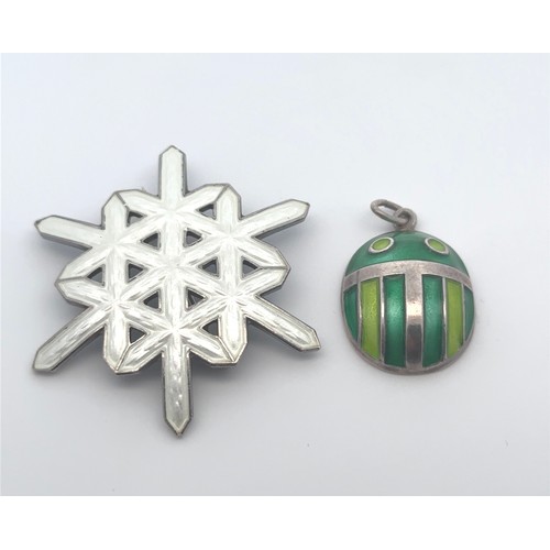 39 - Two Norwegian silver and enamel jewellery items. A silver and enamel snowflake brooch by A Scandinav... 