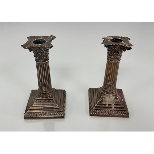 98 - A pair of Corinthian column design silver candlesticks on stepped square bases by William Hutton & S... 