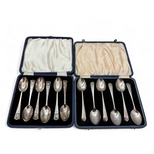 123 - Two cased sets of silver tea spoons. One set plain with rubbed marks.  One set with terminations dec... 