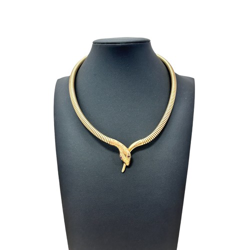 55 - A 9ct gold serpent necklace, bracelet and ring suite. The articulated necklace terminates with a tap... 