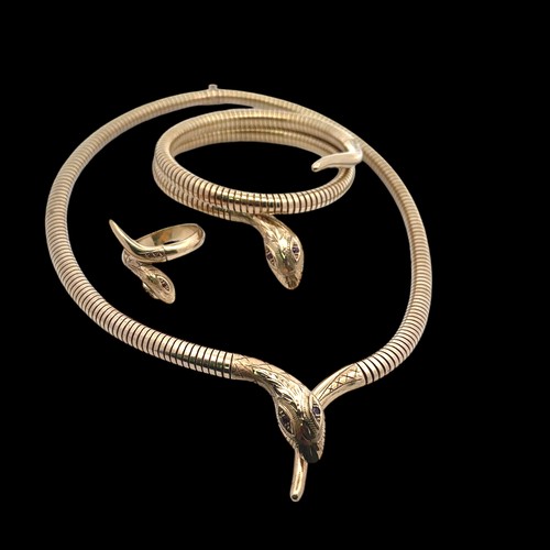 55 - A 9ct gold serpent necklace, bracelet and ring suite. The articulated necklace terminates with a tap... 