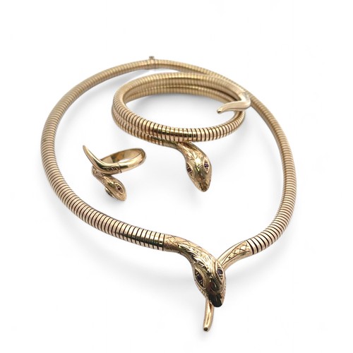 55 - A 9ct gold serpent necklace, bracelet and ring suite. The articulated necklace terminates with a tap... 