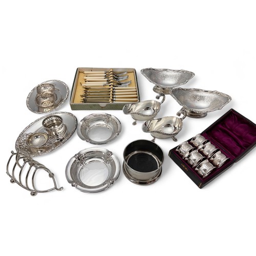 133 - A collection of good quality silver plated items. Includes a cased set of six silver plated napkin r... 