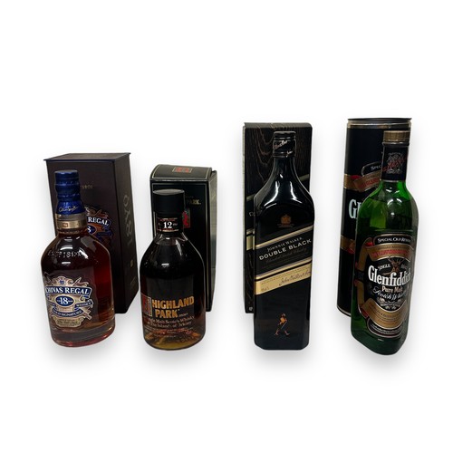 207 - Four Bottles Of Whisky In Boxes. One 70cl bottle of Chival Regal gold signature, in original box, bo... 