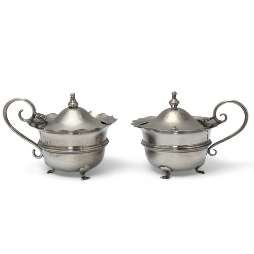 102 - A pair of silver salts with blue glass liners (mismatched).  Hallmarks for A & J Zimmerman Ltd, Birm... 