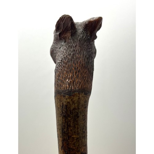 147 - A Brigg carved squirrel head walking stick with glass eyes, stamped Brigg. Length 92cm.