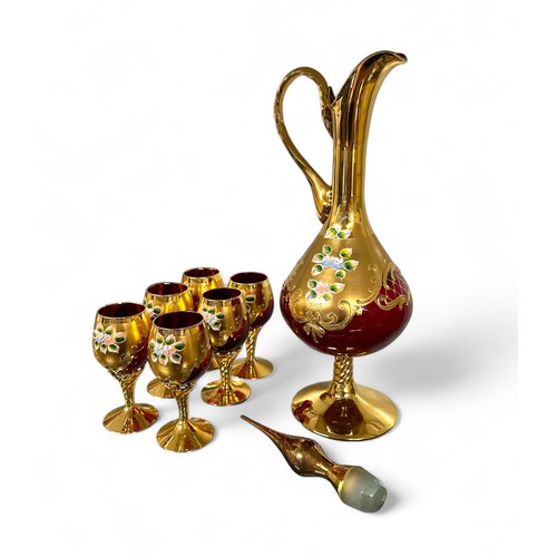 344 - Italian Venetian ruby red decanter set with six glasses. Gold overlay and handpainted floral reliefs... 