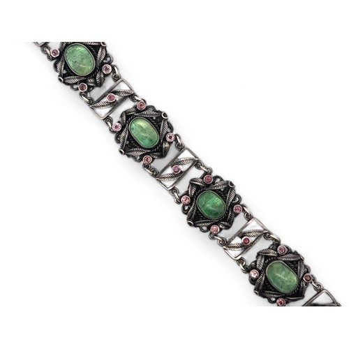 62 - An Arts and Crafts silver, green and pink stone bracelet. Stamped silver to clasp. Stones possibly t... 