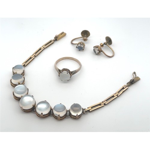 49 - A moonstone bracelet, ring and earrings set. A bracelet, likely early 20th Century, with seven round... 