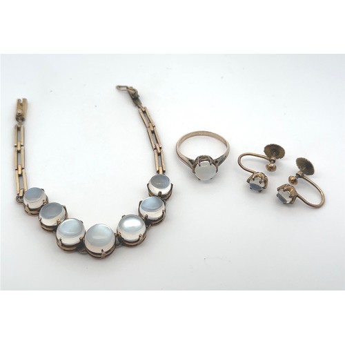 49 - A moonstone bracelet, ring and earrings set. A bracelet, likely early 20th Century, with seven round... 