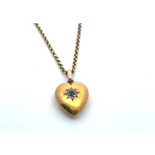 50 - Heart shaped  locket with central sapphire and diamond cluster, stamped 15ct to reverse, on an unmar... 