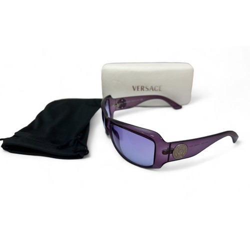 148 - A pair of purple Versace sunglasses with Versace case. Silver toned Medusa to both arms. No. MOD 409... 