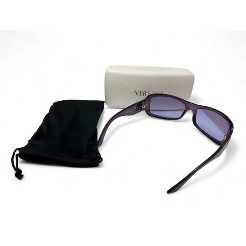 148 - A pair of purple Versace sunglasses with Versace case. Silver toned Medusa to both arms. No. MOD 409... 