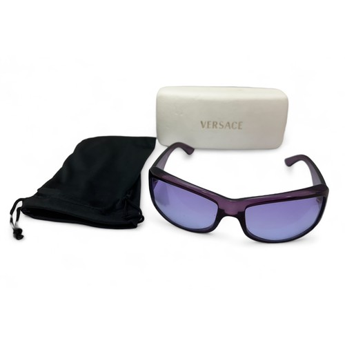 148 - A pair of purple Versace sunglasses with Versace case. Silver toned Medusa to both arms. No. MOD 409... 