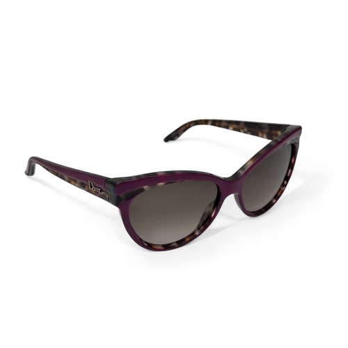 149 - A pair of modern Dior Sauvage purple and tortoise shell effect sunglasses with purple tinted lenses.... 